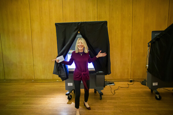 Penn President Amy Gutmann exits the voting booth at Vance Hall
