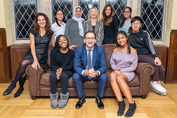 During a study break, President Amy Gutmann and Jon and Mindy Gray congratulate the first cohort of student scholars in the Penn First Plus program that the Grays’ gift is supporting.