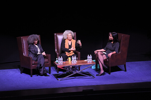 Gina Dent, Angela Davis, and Margo Natalie Crawford seated in discussion on stage 