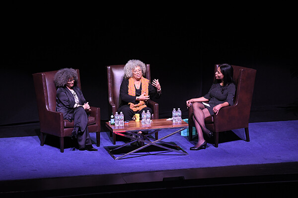 Gina Dent, Angela Davis, and Margo Natalie Crawford seated in discussion on stage