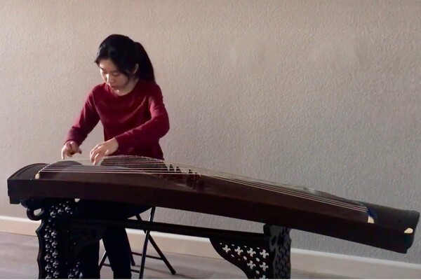 Flora Feng, a senior mathematics and economics major, plays the traditional Chinese guzheng