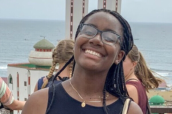 Nakeeya Garland smiling with ocean view in background