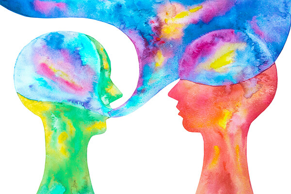 watercolor of two heads in profile with a large dialogue box coming from one figure like a cloud over the other head in bright colors