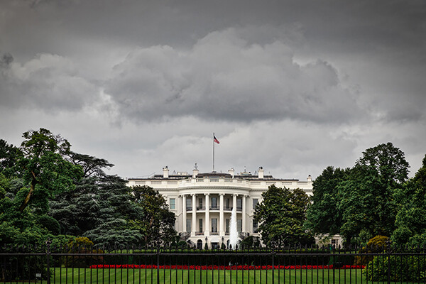 White House seen with stormy clouds overhead.