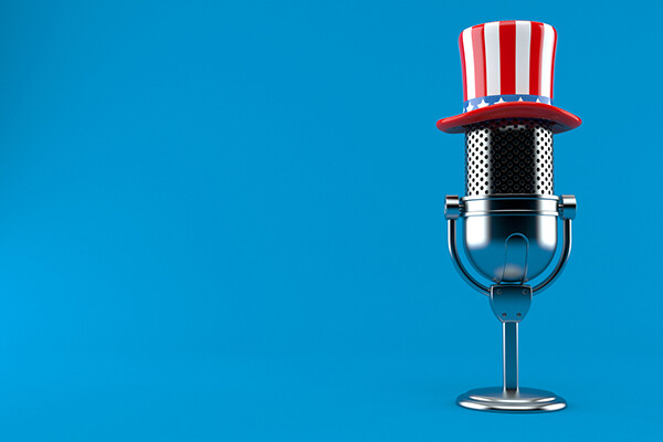 Radio microphone with patriotic hat on top.