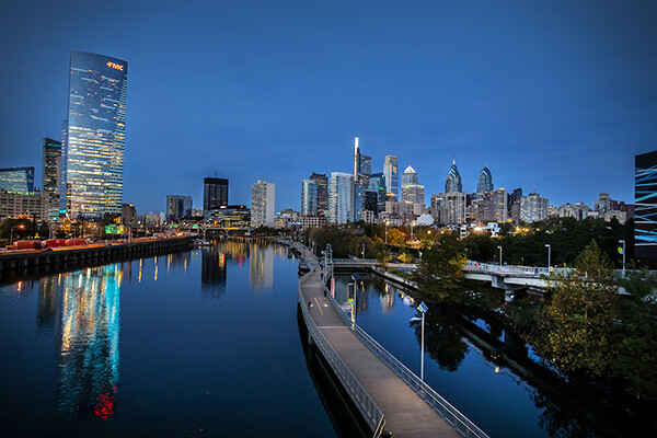 View of Philadelphia skyline from the Schuylkill River at dusk.