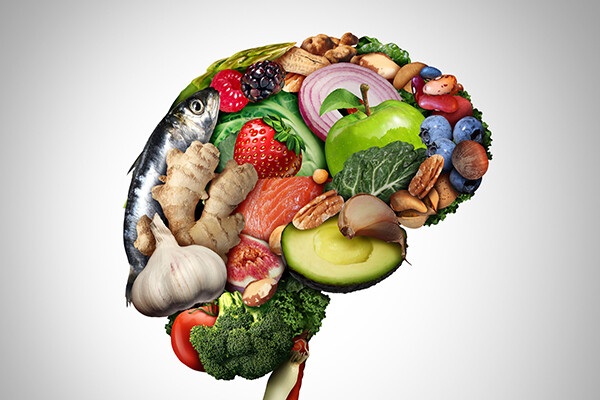 Outline of a human brain made up of healthy, nutritious food.