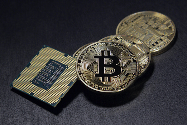  picture of coins with the letter "B" on it and computer chip