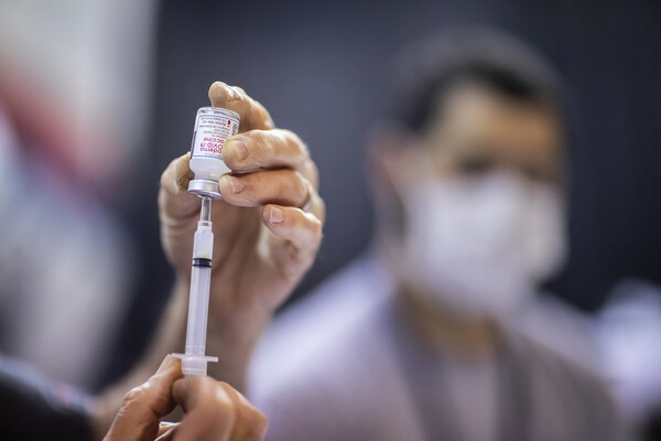 preparing a shot at the vaccine clinic