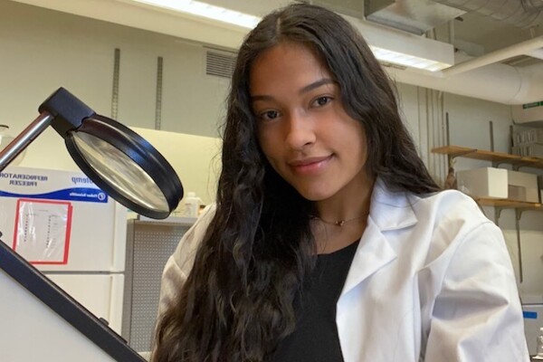 Student Amy Fernandez in a lab