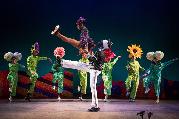 Dancers doing kicks on stage