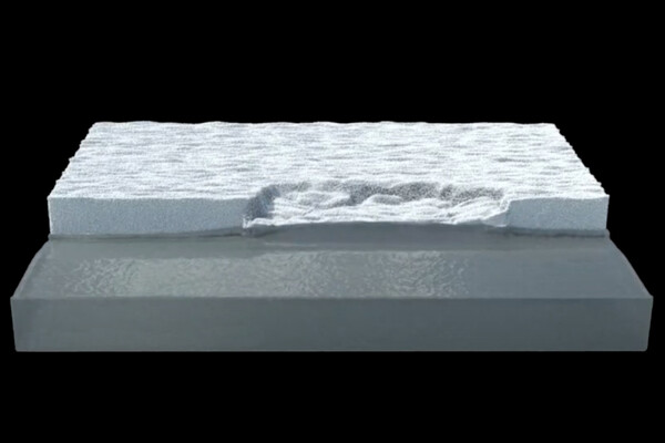 Computer simulation of a sheet of glacial ice breaking apart.