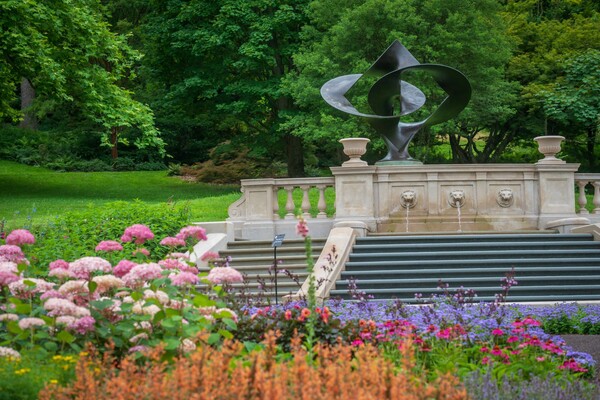 Step Fountain and surrounding garden flowers