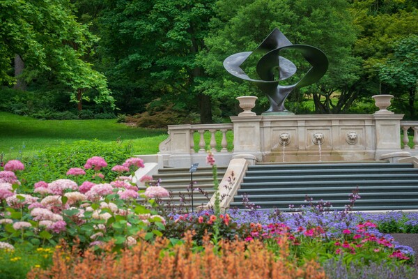 Step Fountain and surrounding garden flowers