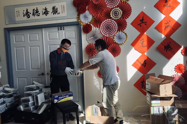 Supplies being handed to someone inside a Chinese language school