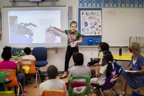 gse student give a presentation in the front of a classroom