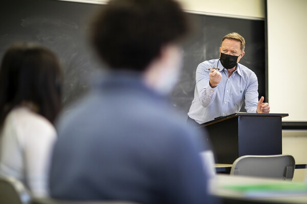 dennis culhane teaching in a classroom