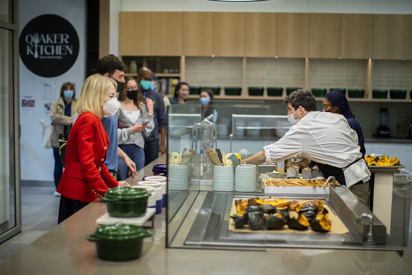 People in line in a cafe kitchen