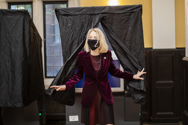 Amy Gutmann leaves voting booth