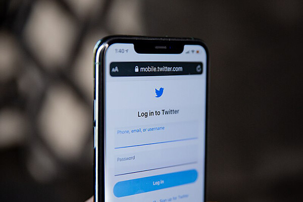 Smartphone screen displaying a login for a Twitter account.