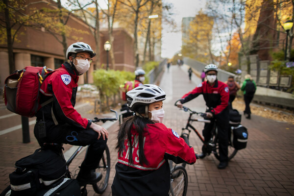 mert students on their bikes on locust walk