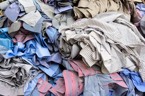 A large pile of discarded shirts.