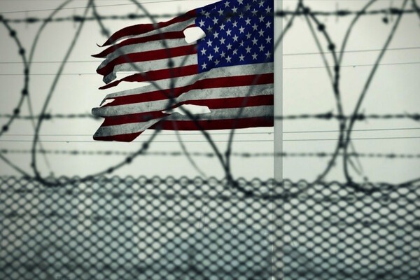 Torn American flag flying at Guantánamo Bay.