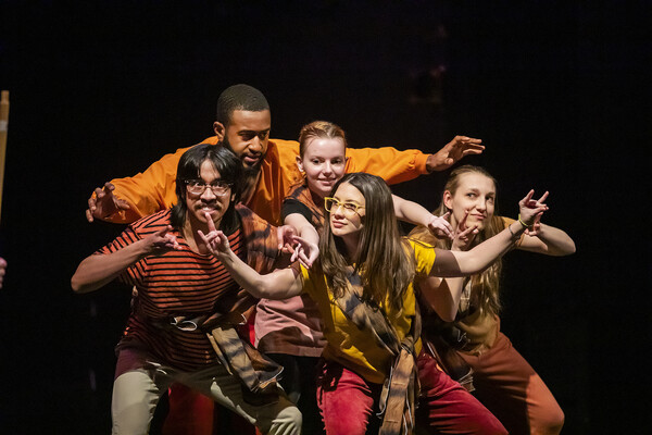 students performing on stage