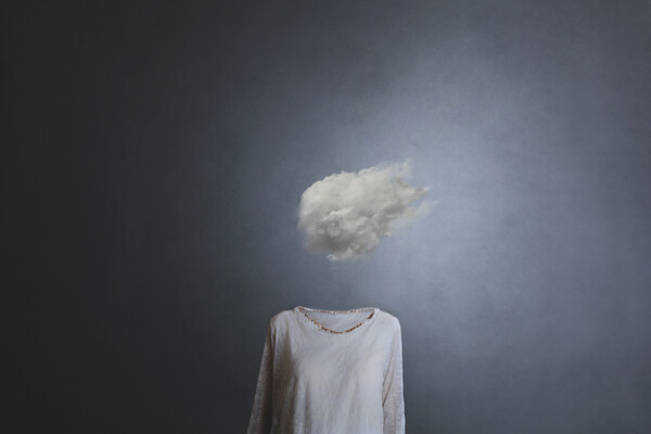 Person’s chest and torso but head is replaced by a small cloud.