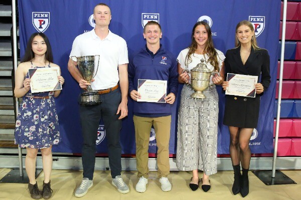 At the Quaker's Choice Awards at the Palestra, from left, Kristina Khaw, Sam Handley, Theo Lenz, Gracyn Banks, and Nikola Kovacikova stand with their trophies and awards