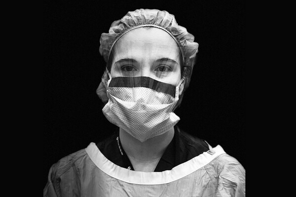 Medical professional headshot in full PPE.