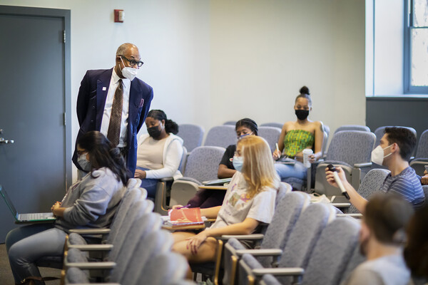 Herman Beavers converses with students