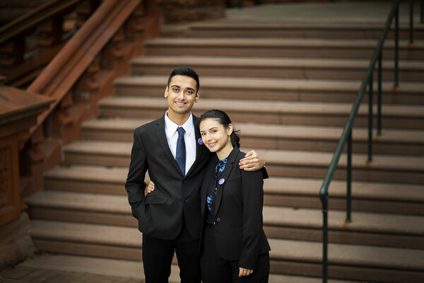 Manoj Simha and Rowana Miller standing on stairway