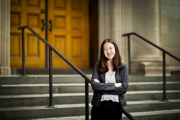 a portrait of angelina heyler outside on a staircase