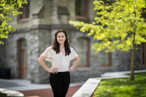 A portrait of Edie Noor Graber outside of College Hall.