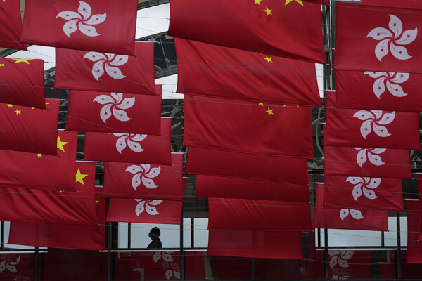 Hong Kong and Chinese flags fly in advance of the 25th anniversary of the handover of Hong Kong from Britain