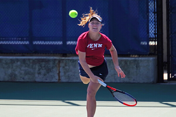 Iuliia Bryzgalova watches the ball soar of toward the next after swinging her serve at the Penn tennis courts.