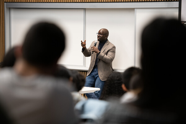Jamelle Bouie speaking to a crowd in a lecture hall.