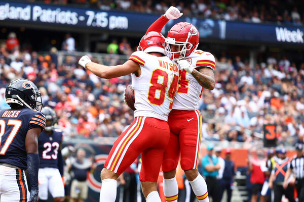 Justin Watson, left, and a teammate jump in the air and celebrate after Watson scored a touchdown against the Chicago Bears in a preseason game.