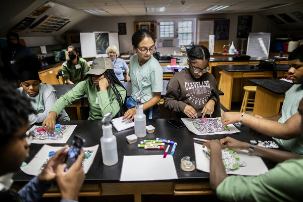 A group of students working on a project at Cobbs Creek.