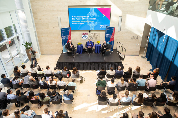 Former Australian Prime Minister Malcolm Turnbull, Kathleen Hall Jamieson and Penn climate scientist Michael E. Mann sit on a stage at Perry World house in front of an audience of listeners