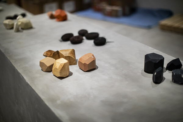 Odd-shaped blocks arranged on a concrete surface
