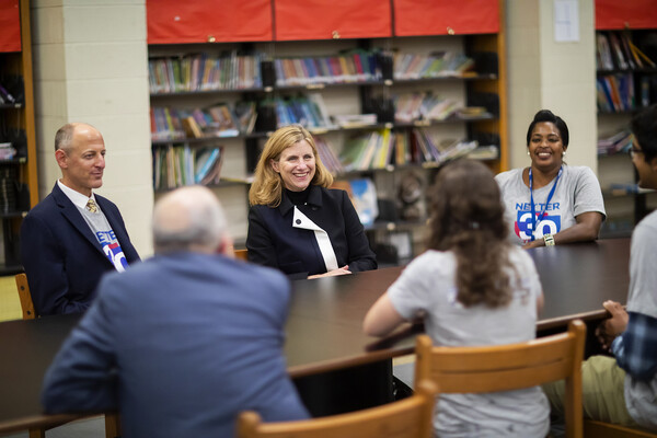 penn president liz magill sits at a table at hamilton school