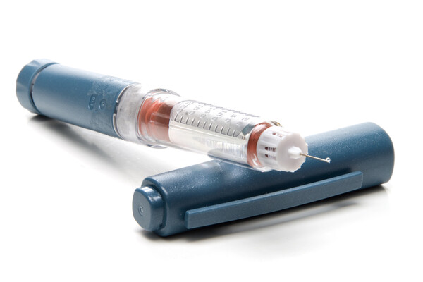 An uncapped insulin pen.