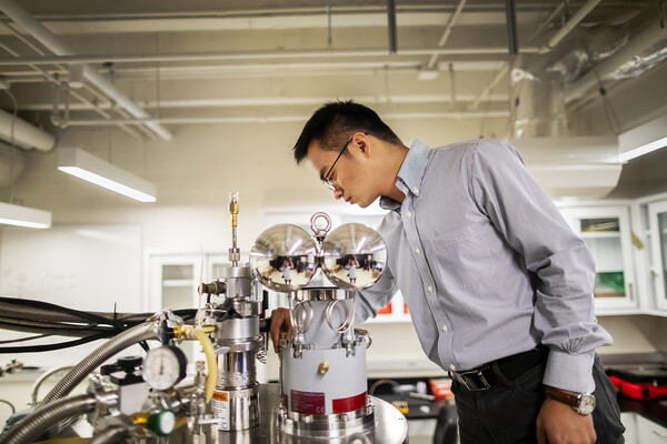 Liang Wu working on kagome materials in a lab. 