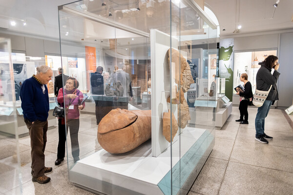 half dozen people in a museum gallery