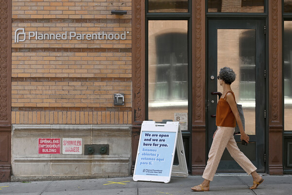 A person walks past the door at Planned Parenthood.