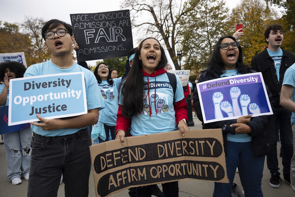 Affirmative action advocates rally outside the U.S. Supreme Court, holding signs that read "defend diversity, affirm opportunity" as justices heard oral arguments on two cases on whether colleges and universities can continue to consider race as a factor in admissions decisions.