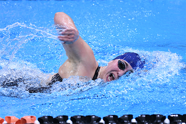 Anna Kalandadze takes a breath while swimming a lap at the Ivy League Championships.