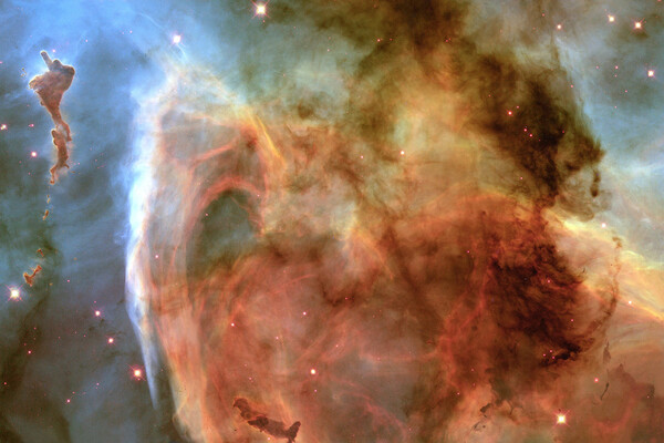 An image of a nebula, a giant cloud of dust and gas in space. 